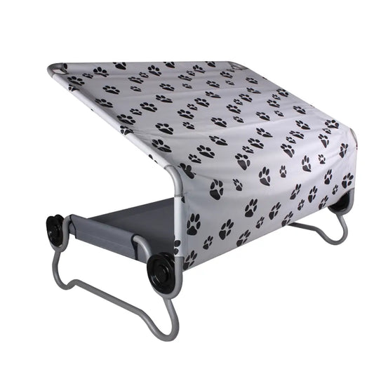 Pet bed with paw print cover on a white background